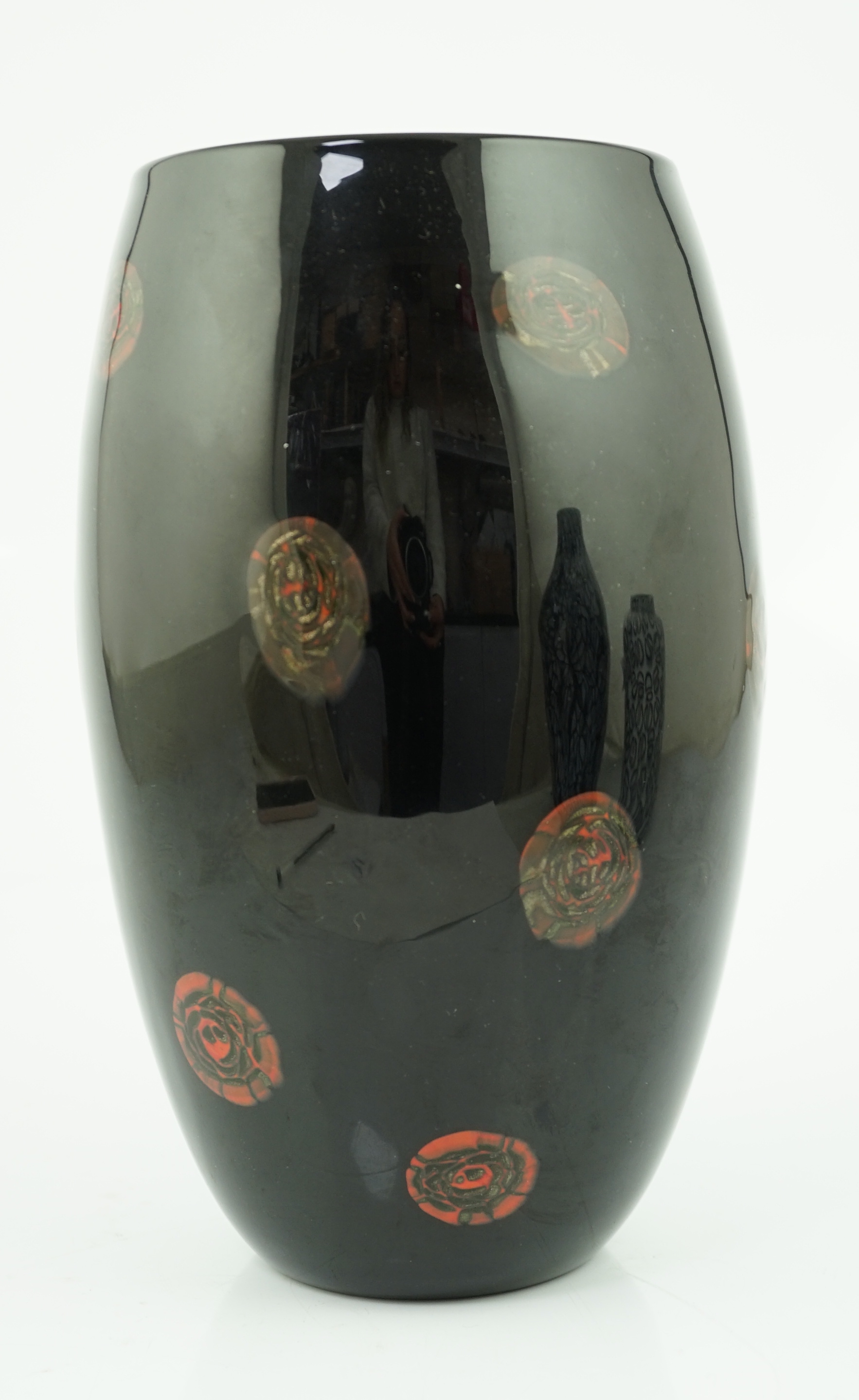 Vittorio Ferro (1932-2012) A Murano glass Murrine vase, with bronze roundels on a black ground, unsigned, 28cm, Please note this lot attracts an additional import tax of 20% on the hammer price